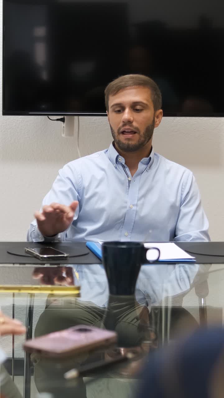 Businessman presenting ideas during corporate meeting. Vertical footage