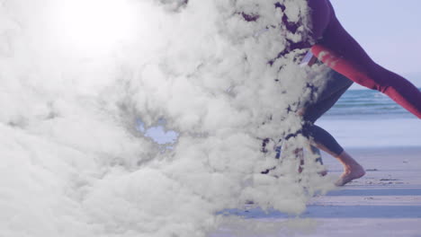 running on beach with cloud animation overlay, people enjoying sunny day