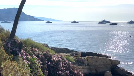 boats floating in the sunlit waters of the french riviera in summer at pointe fontettes, saint-jean-cap-ferrat, france