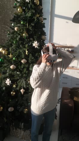 woman wearing vr headset near christmas tree