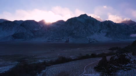 sunset behind the mountain peaks of alabama hills in inyo county, california. aerial drone shot