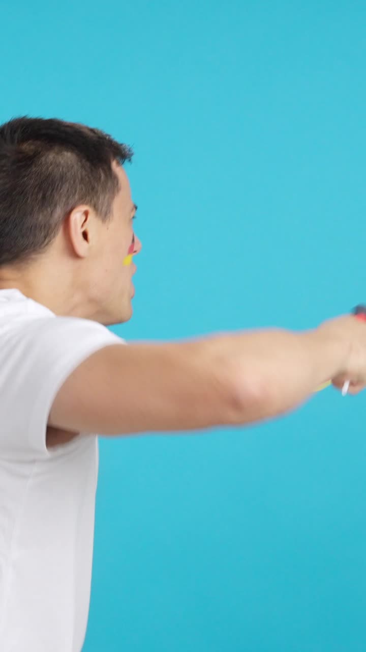 Rear view of a man waving a german pennant