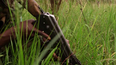 close up soldier holding an ak 47