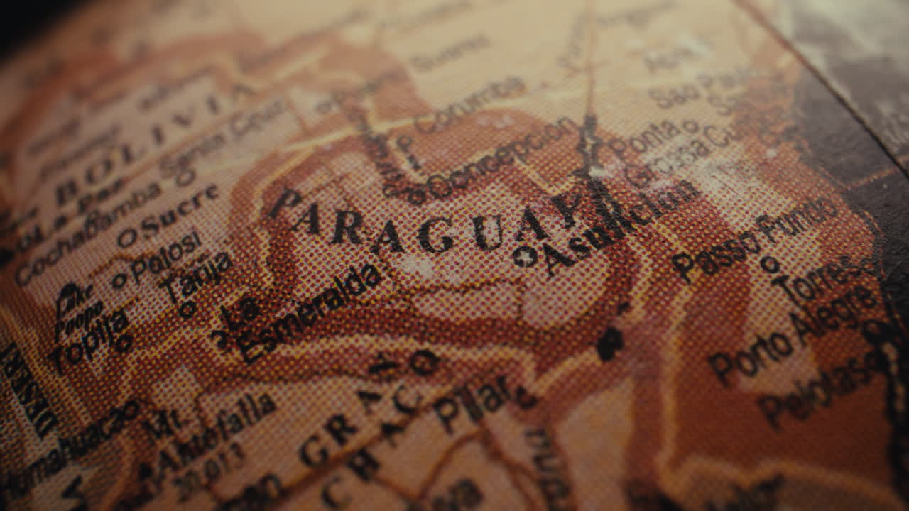 Close-up of a vintage world globe focusing on Paraguay