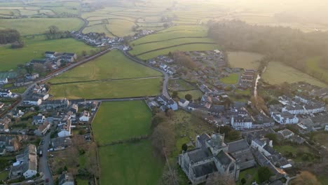 Aerial-footage-of-the-Medieval-village-of-Cartmel-in-the-English-Lake-District-it-has-a-rich-heritage,-and-varied-list-of-activities-for-visitors-and-tourists