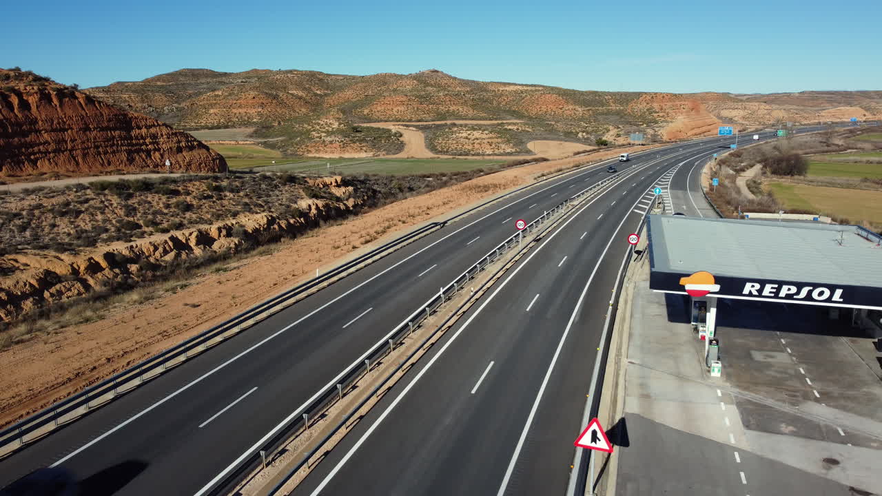 Highway with Gas Station and Scenic Landscape
