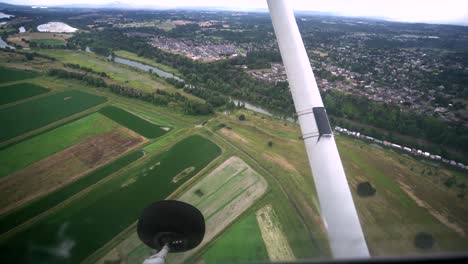 Beautiful-footage-looking-down-a-farms-and-rivers-near-Vancouver,-Washington-from-a-small-airplane