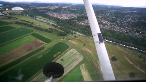 beautiful footage looking down a farms and rivers near vancouver, washington from a small airplane