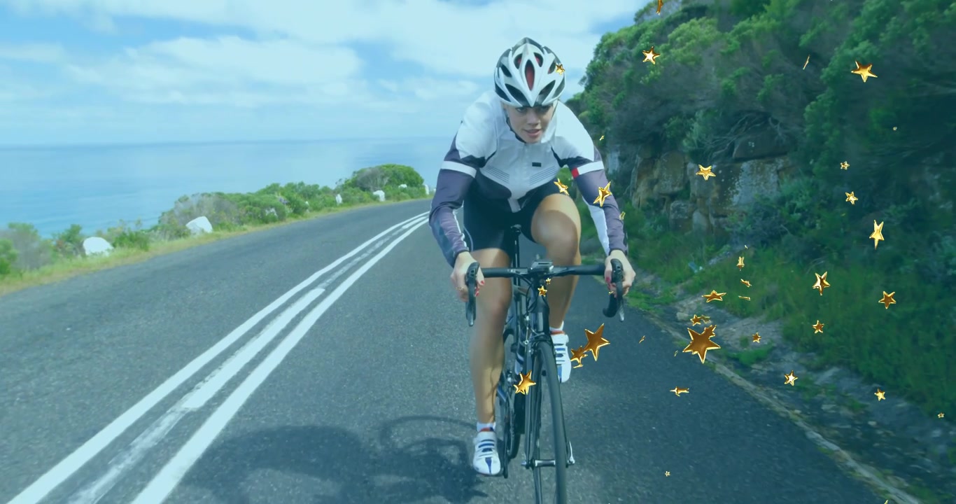 Ciclista che inizia a pedalare su una strada costiera, costruendo resistenza con stelle dorate che fluttuano.