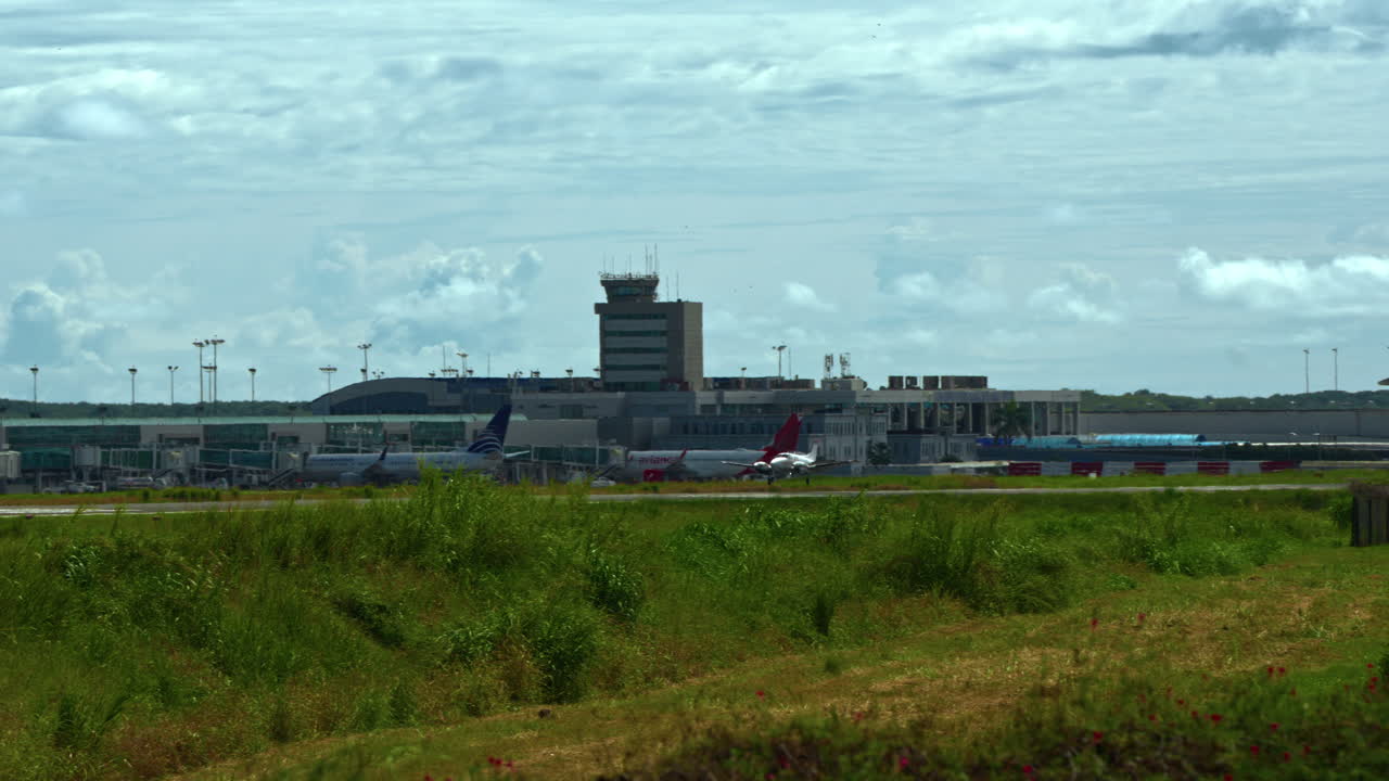 Slowmotion shot of a propellor plane landing at Tocumen International Airport