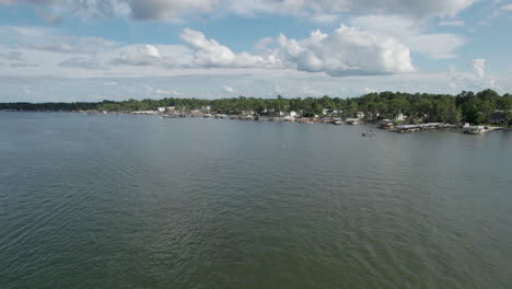 Wide-drone-shot-of-White-lake-with-docks-and-lake-houses