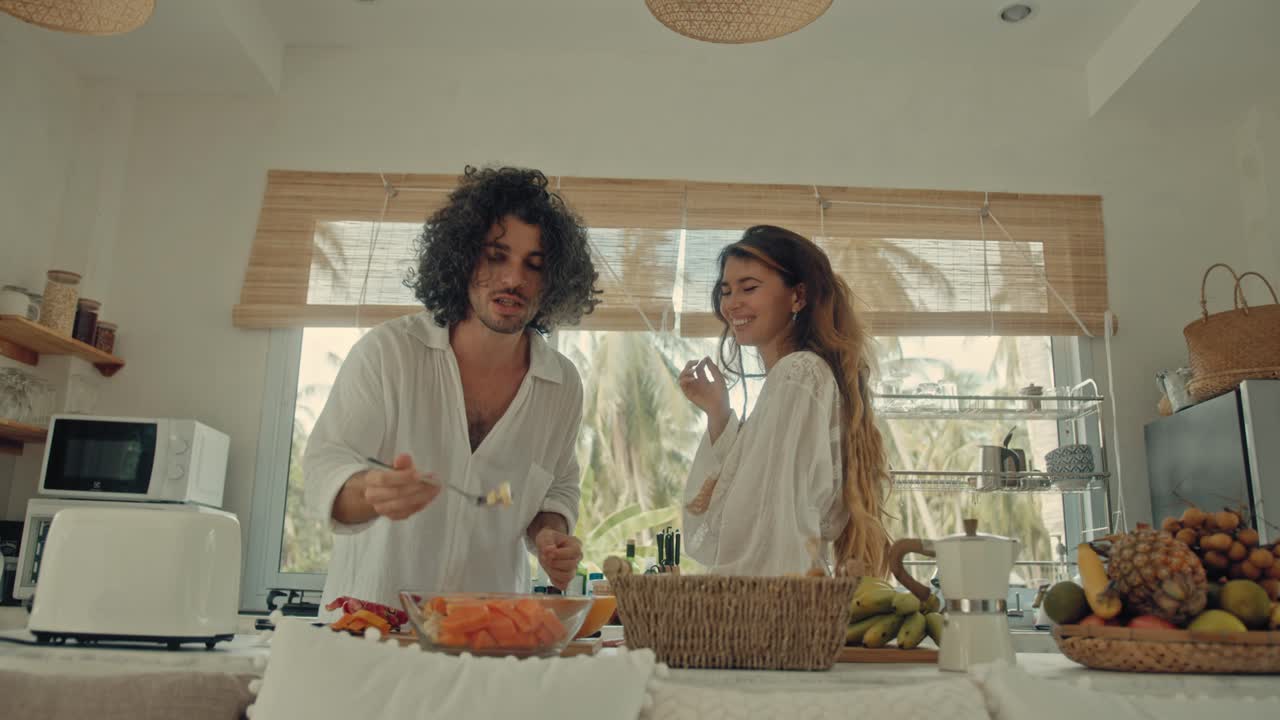 Couple Cooking Together in a Tropical Kitchen