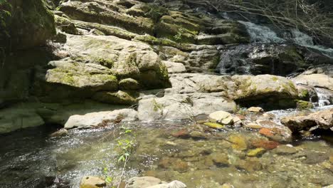 rest stop in riverside hiking concept visiting water park natural landscape of waterfall in hyrcanian forest in iran nature scenic wonderful panoramic woman naked foot white skin lovely legs splash