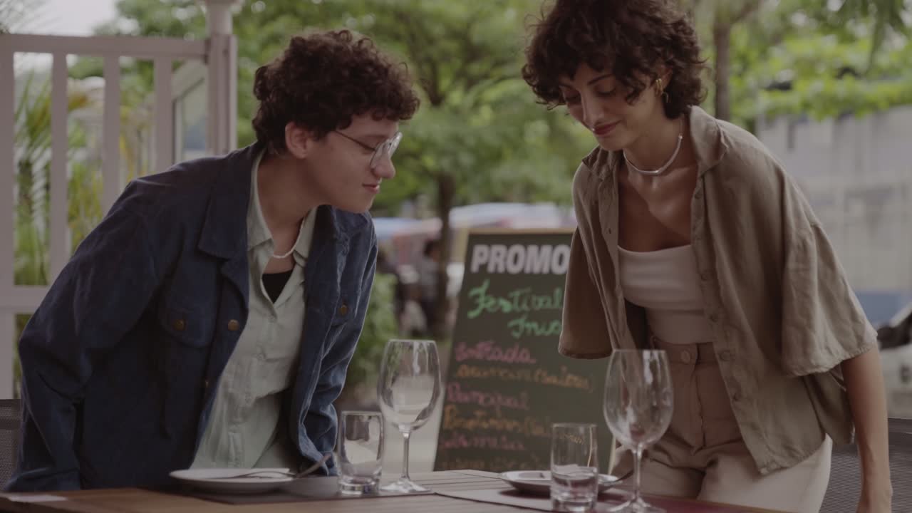 Two People Dining at an Outdoor Restaurant