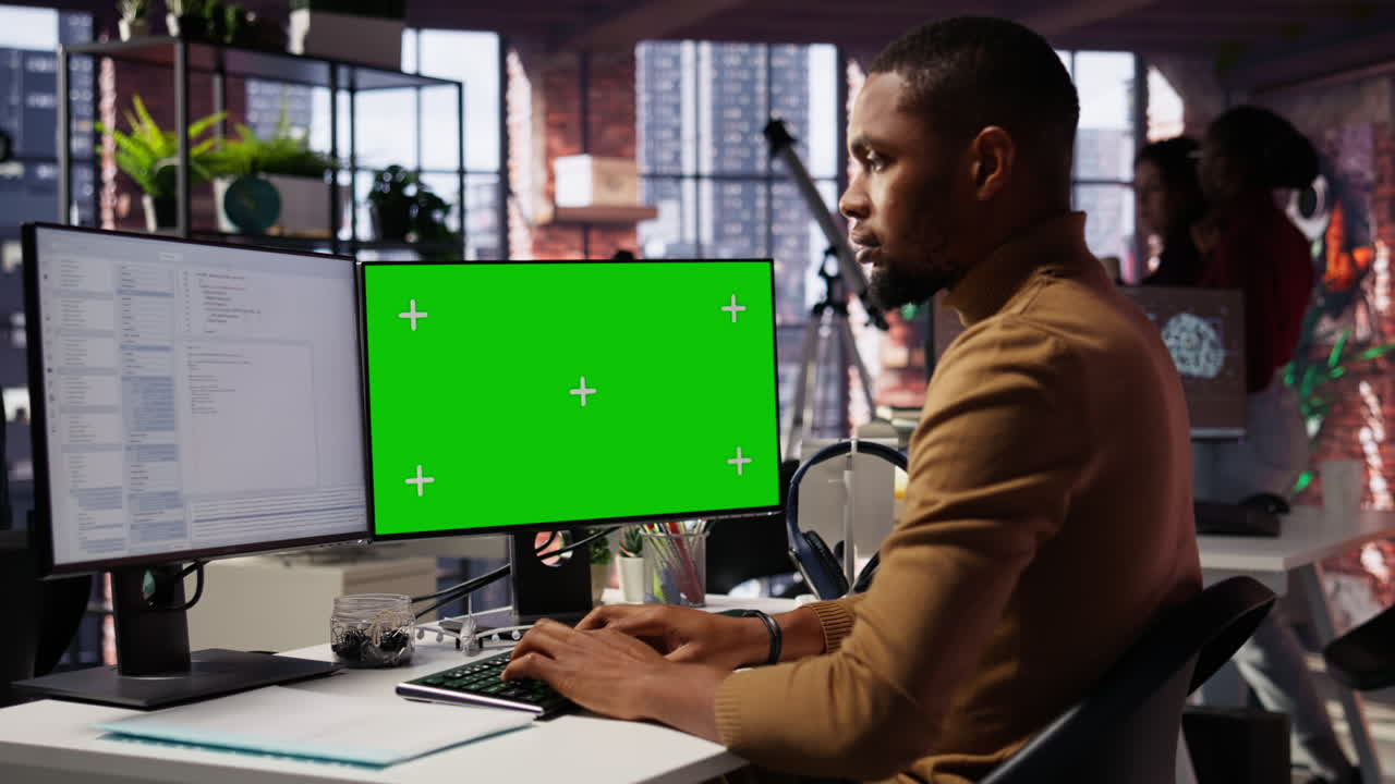 Programmer coding in AI startup office using isolated screen PC