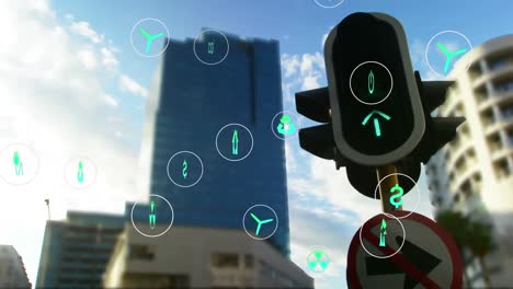 animation of multiple icons over low angle view of red signal against buildings and cloudy sky