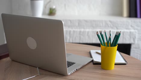 Office-workplace-with-notebook-on-wood-table.