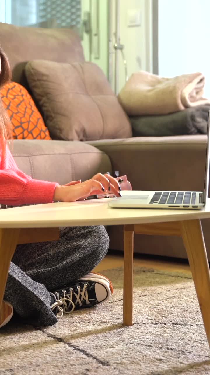 Woman playing guitar indoors
