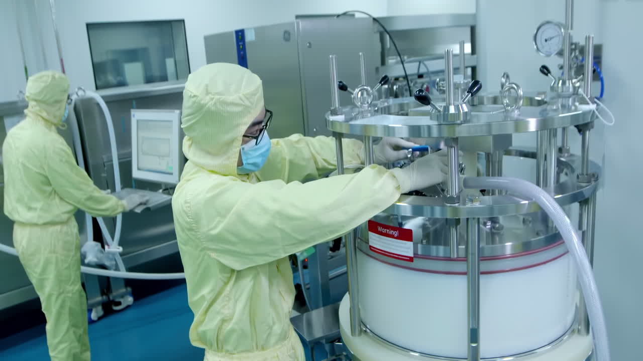 Scientist in uniform work wearing mask in high-tech stainless steel industrial processing tank control panel for automation, advanced industrial equipment production pharmaceutical biopharmaceuticals