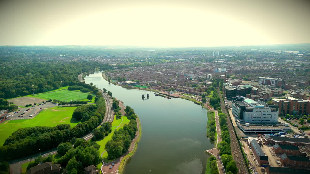 Wide travelling aerial GV of Belfast City Centre, Northern Ireland, UK on a bright and sunny day. Produced in 4K, 60FPS and with Rec709 color