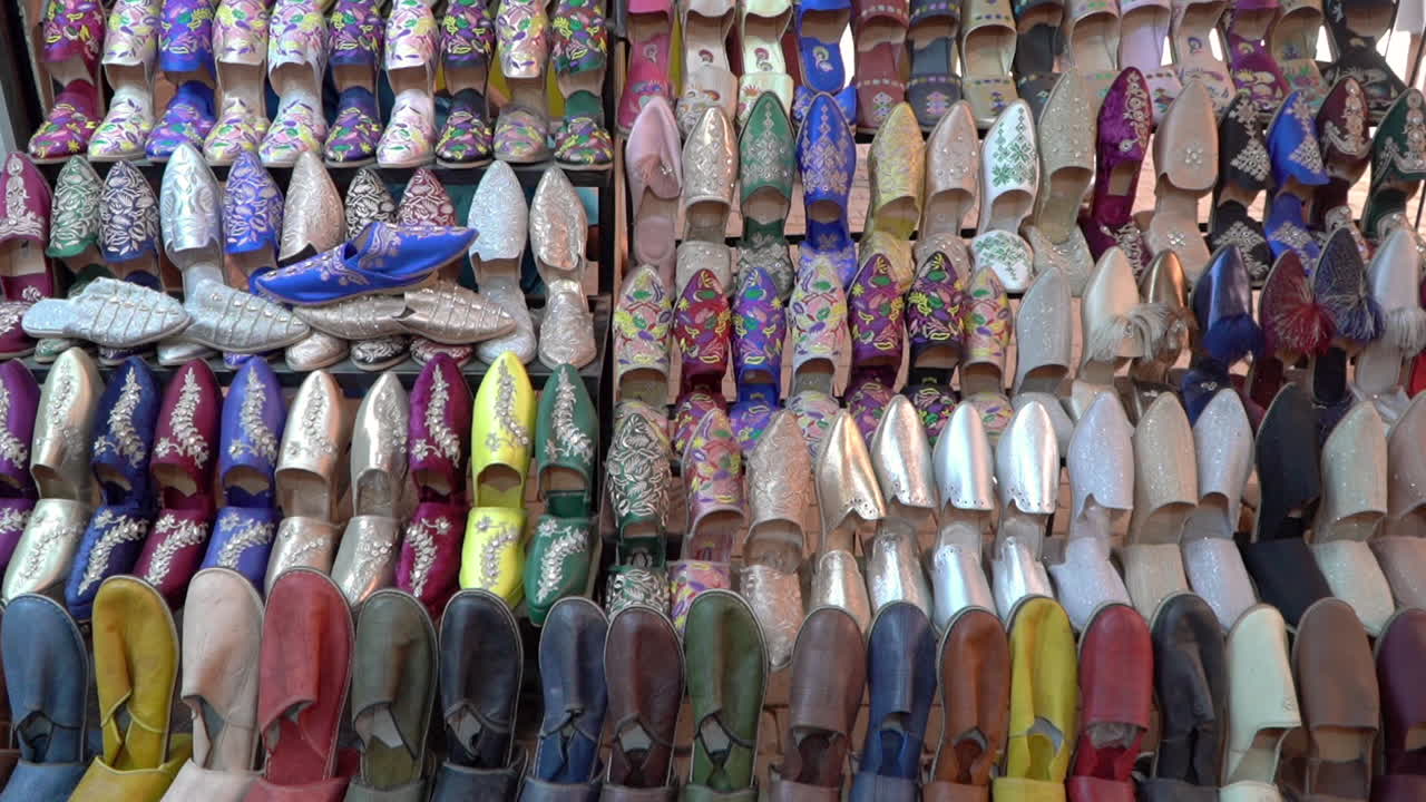 Discover the rich heritage of Morocco with authentic belgha leather shoes in Marrakech's vibrant old medina market