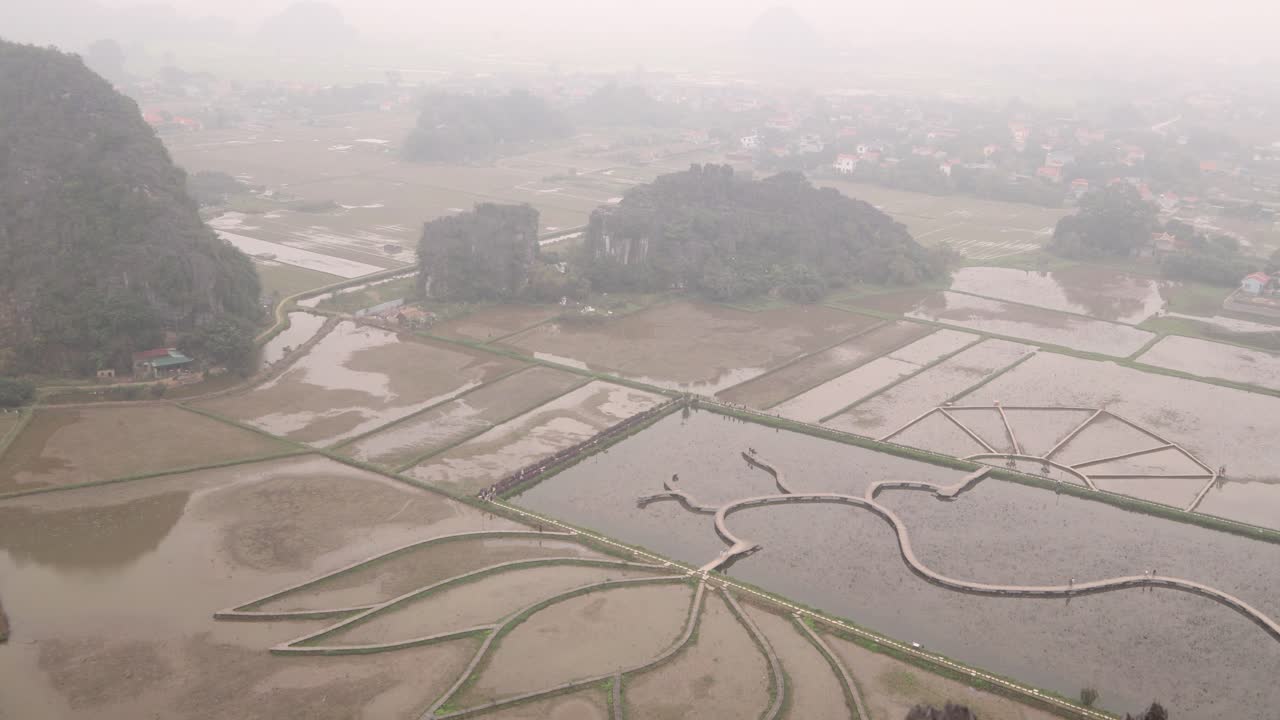 viewpoint looking down on the lotus pond below filled with water and reflection in the mountainous region of Ninh Ninh in Northern Vietnam
