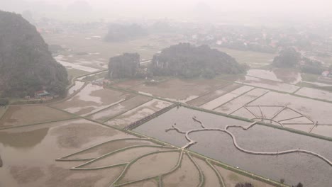 viewpoint looking down on the lotus pond below filled with water and reflection in the mountainous region of ninh ninh in northern vietnam