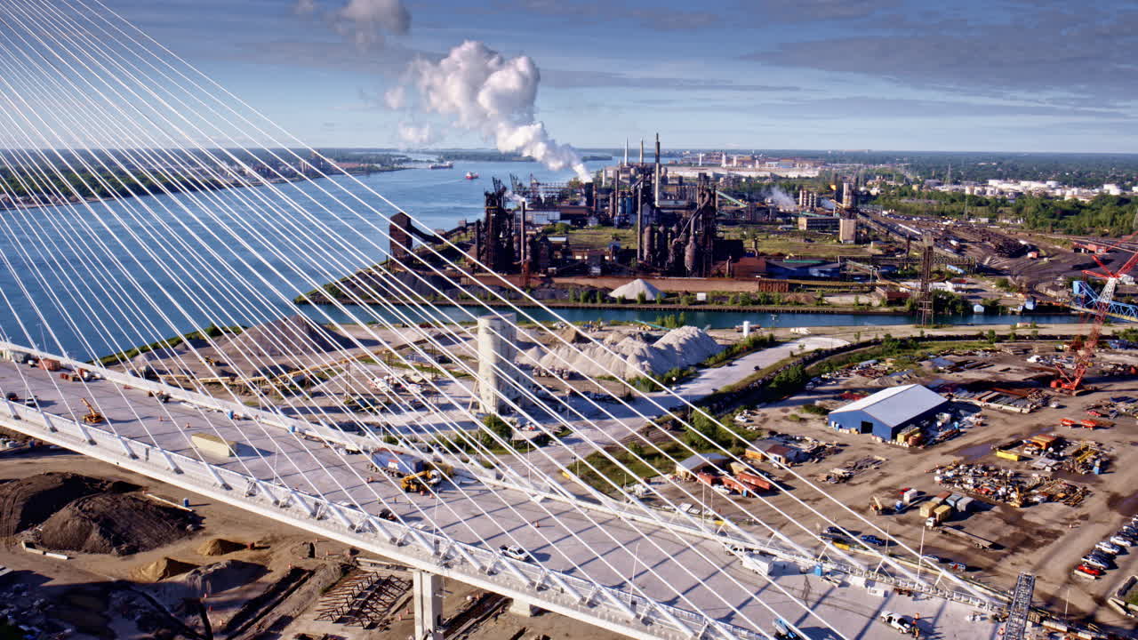 Cinematic drone shot wrapping around the cross-border bridge between the two countries