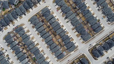 aerial view of a modern suburban community in calgary, canada, in spring after the snow melt