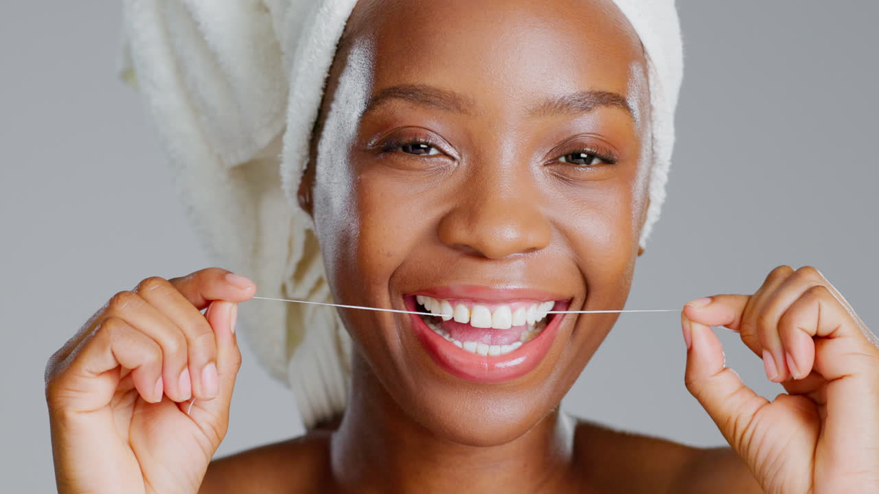 Smile, dental and floss with black woman in studio