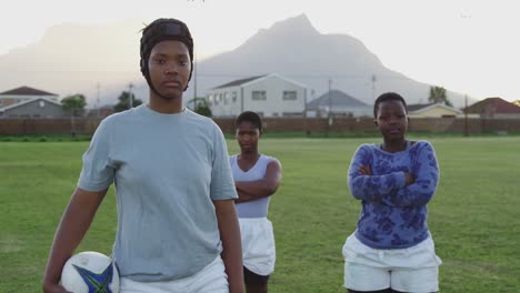 Young-adult-female-rugby-team-training