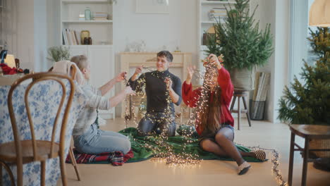 friends sorting tangled illuminated lighting