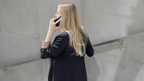 woman talking on phone outdoors