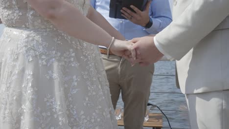 Bride-and-groom-make-vows-at-ceremony