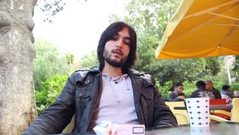 young man smoking cigarette