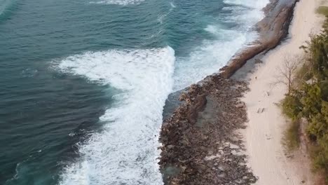 Drone-aerial-pan-down-ocean-waves-blue