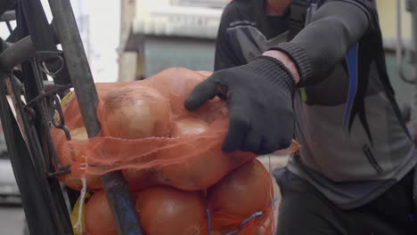 unloading onions from sack truck