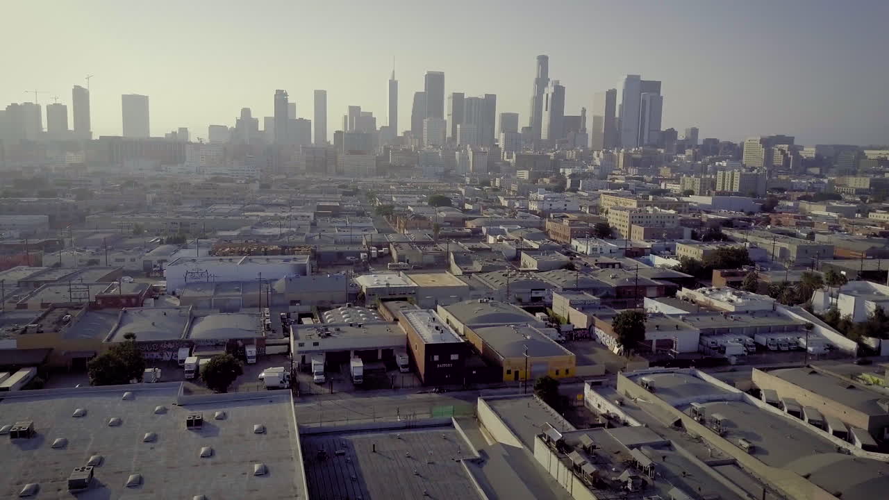 Aerial view of the Los Angeles skyline and industrial buildings
