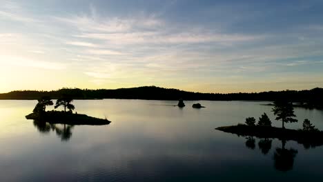 Generous-clip-of-a-flight-over-a-lake-during-an-amazing-golden-sunrise