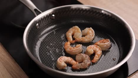 frying shrimp in a pan