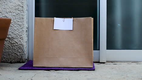 grocery bag left at the door by delivery boy