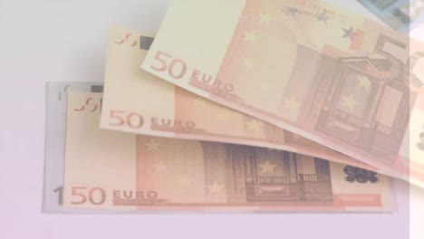 animation of close up of euro bills flying against grey background