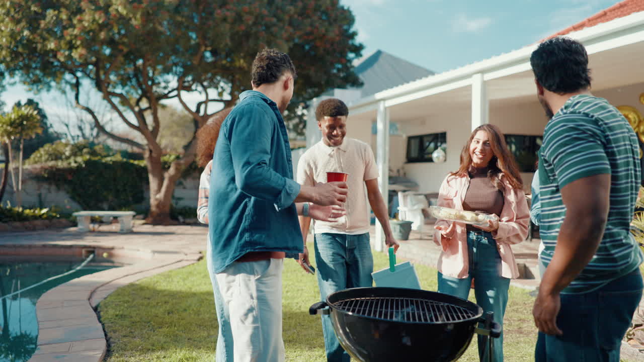 Group of friends having a barbecue in the backyard