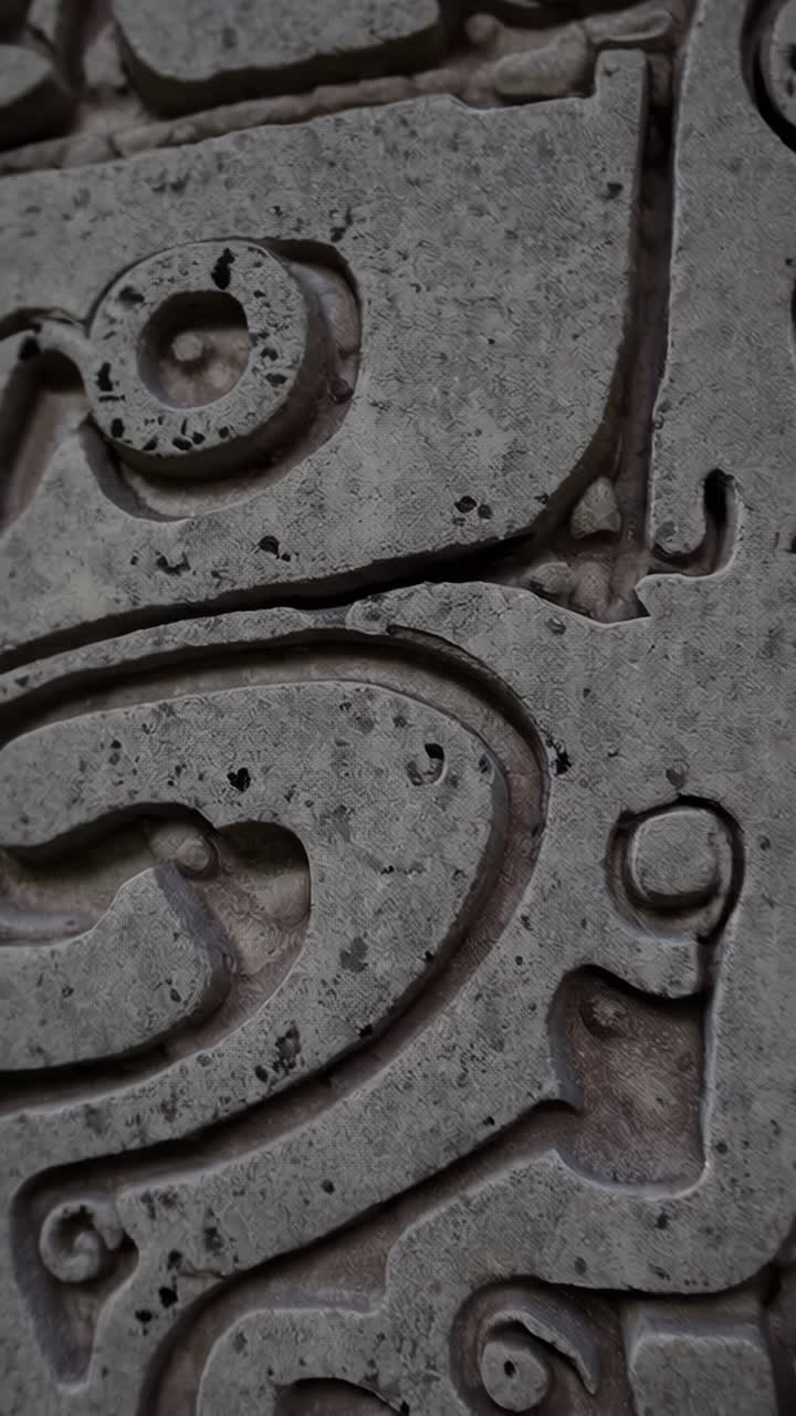 Archaeologist Examining Ancient Mayan Carvings