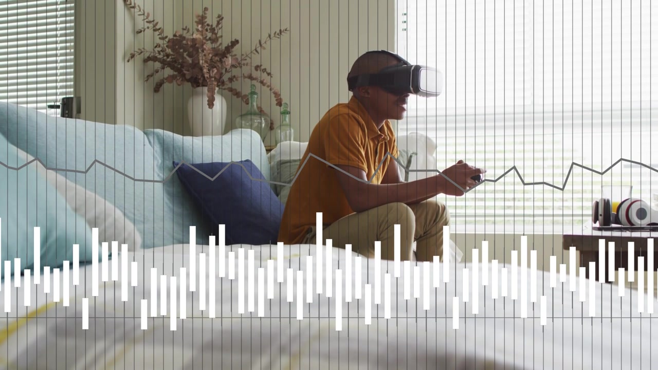 Male teen using VR controllers on sofa, initiating audio waveform and line graph overlay for tech