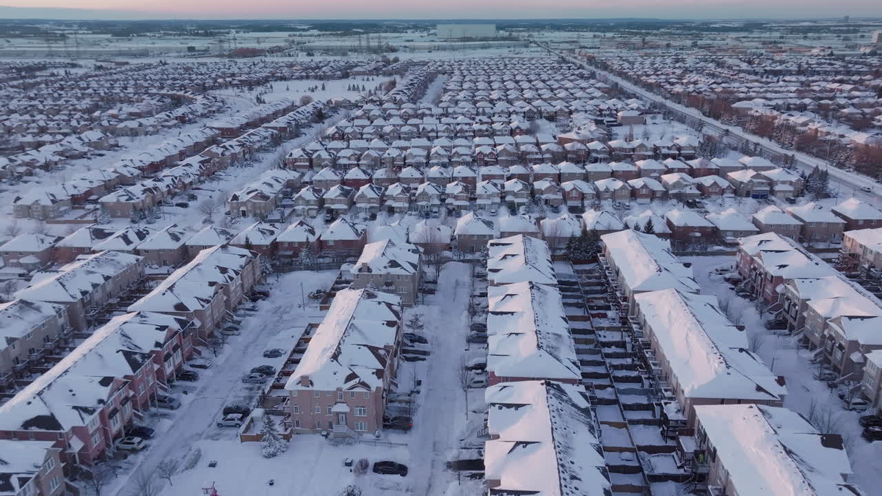 Snowy aerial view of suburban Mississauga homes in winter scenery