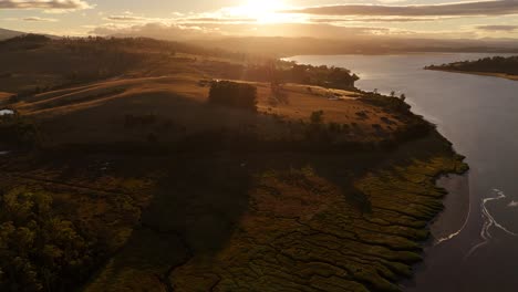 4k60 beautiful tamar river in tasmania australia, drone view of epic sunset over landscape