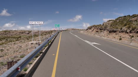 koti se phola road sign by highway in highlands of lesotho, africa