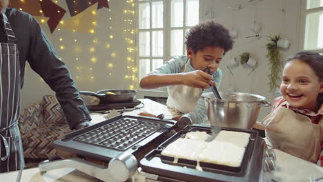 Little-Boy-Preparing-Waffles-on-Cooking-Masterclass