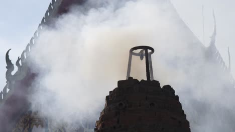 smoke rising from a temple offering